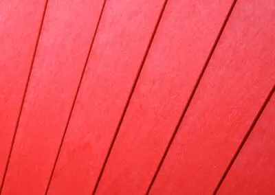 Close-up of red recycled plastic slats on Mobek outdoor furniture