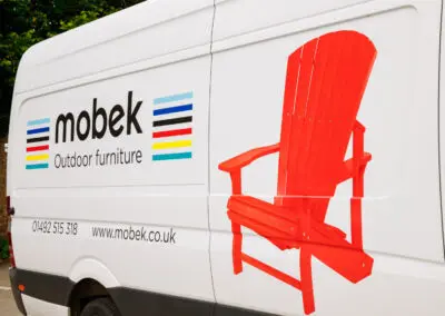 Mobek branded delivery van side panel with logo and Adirondack chair graphic | Mobek