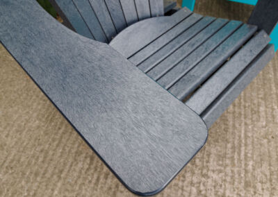 Close-up detail of grey recycled plastic outdoor chair arm corner texture | Mobek