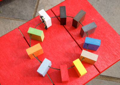 Overhead view of Mobek recycled plastic colour sample chips arranged in a circle