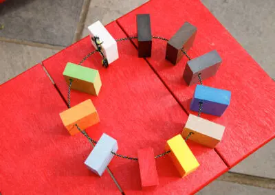 Overhead view of Mobek recycled plastic colour sample chips arranged in a circle