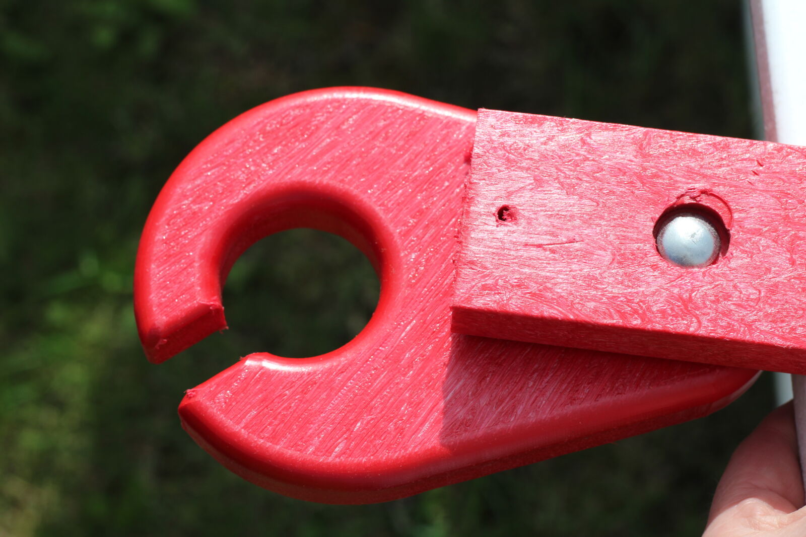 Red recycled plastic outdoor furniture arm end cap close-up | Mobek