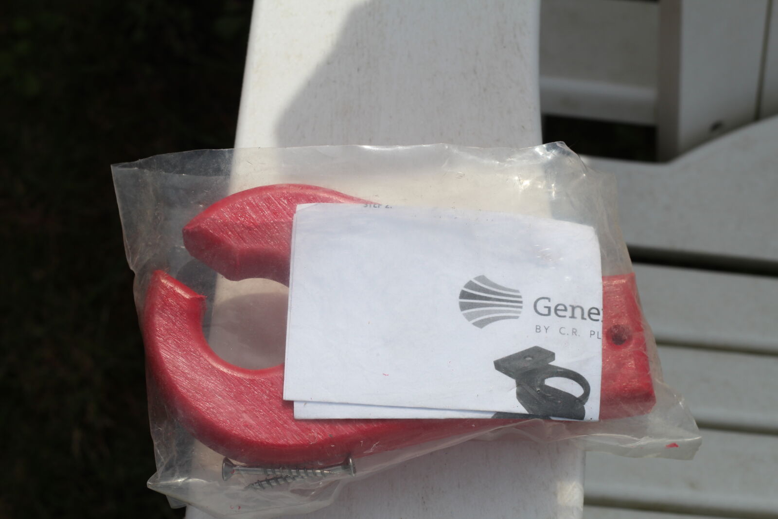 Red recycled plastic chair rocker component in packaging | Mobek