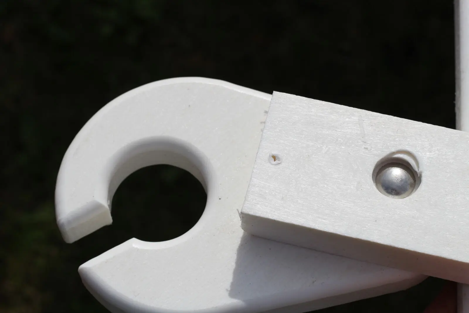 White recycled plastic outdoor furniture arm end cap close-up | Mobek